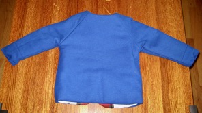 Back view of cobalt blue coat with raglan sleeves